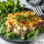 baked keto tuna casserole in white dish with golden melted cheese.